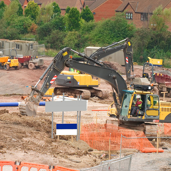 construction workers looking at buildings